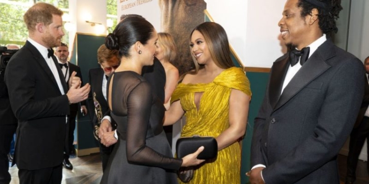 Britain's Prince Harry, Duke of Sussex (L) and Britain's Meghan, Duchess of Sussex (2nd L) meets cast and crew, including US singer-songwriter Beyoncé (C) and her husband, US rapper Jay-Z (R) as they attend the European premiere of the film The Lion King in London on July 14, 2019. (Photo by Niklas HALLE'N / POOL / AFP)        (Photo credit should read NIKLAS HALLE'N/AFP/Getty Images)
