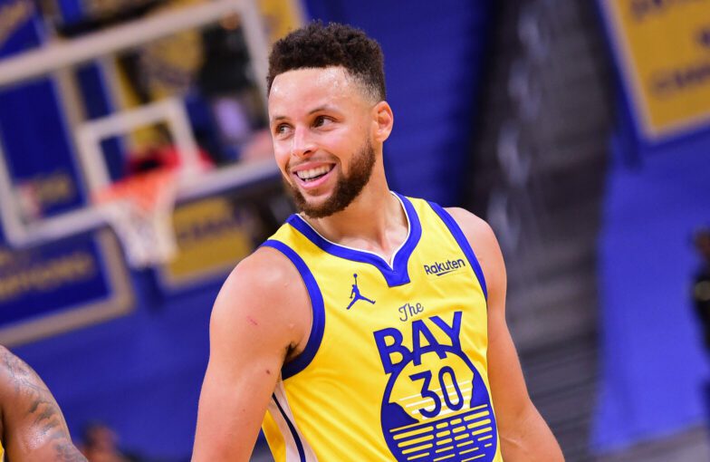 SAN FRANCISCO, CA - APRIL 6: Stephen Curry #30 of the Golden State Warriors smiles and walks off the court against the Milwaukee Bucks on April 6, 2021 at Chase Center in San Francisco, California. NOTE TO USER: User expressly acknowledges and agrees that, by downloading and or using this photograph, user is consenting to the terms and conditions of Getty Images License Agreement. Mandatory Copyright Notice: Copyright 2021 NBAE (Photo by Noah Graham/NBAE via Getty Images)