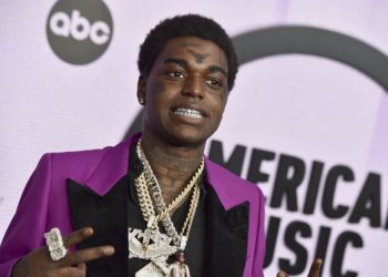 FILE - Kodak Black arrives at the American Music Awards on Nov. 20, 2022, at the Microsoft Theater in Los Angeles. A Florida judge issued an arrest warrant for the rapper, whose given name is Bill Kapri, on Thursday, Feb. 23, 2023, for failing a drug test while on bail for a drug charge, court records show. (Photo by Jordan Strauss/Invision/AP, File)