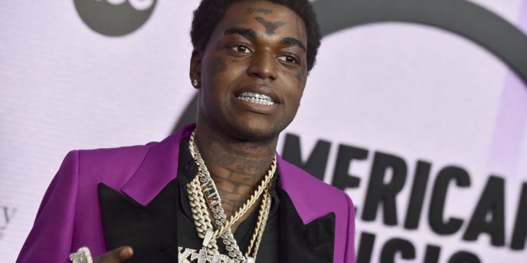 FILE - Kodak Black arrives at the American Music Awards on Nov. 20, 2022, at the Microsoft Theater in Los Angeles. A Florida judge issued an arrest warrant for the rapper, whose given name is Bill Kapri, on Thursday, Feb. 23, 2023, for failing a drug test while on bail for a drug charge, court records show. (Photo by Jordan Strauss/Invision/AP, File)
